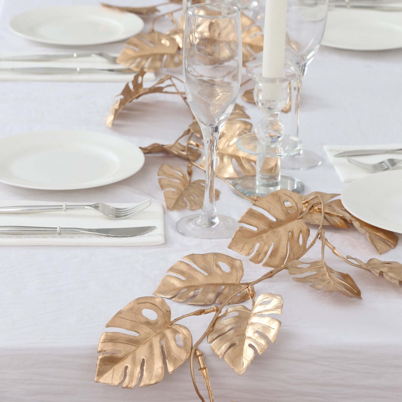 artificial-monstera-leaf-table-garland-7ft-metallic-gold-faux-hanging-vine-for-jungle-tropical-themed-weddings-parties-events Artificial Monstera Leaf Table Garland 7ft Metallic Gold - Faux Hanging Vine for Jungle Tropical Themed Weddings Parties & Events - Image 1
